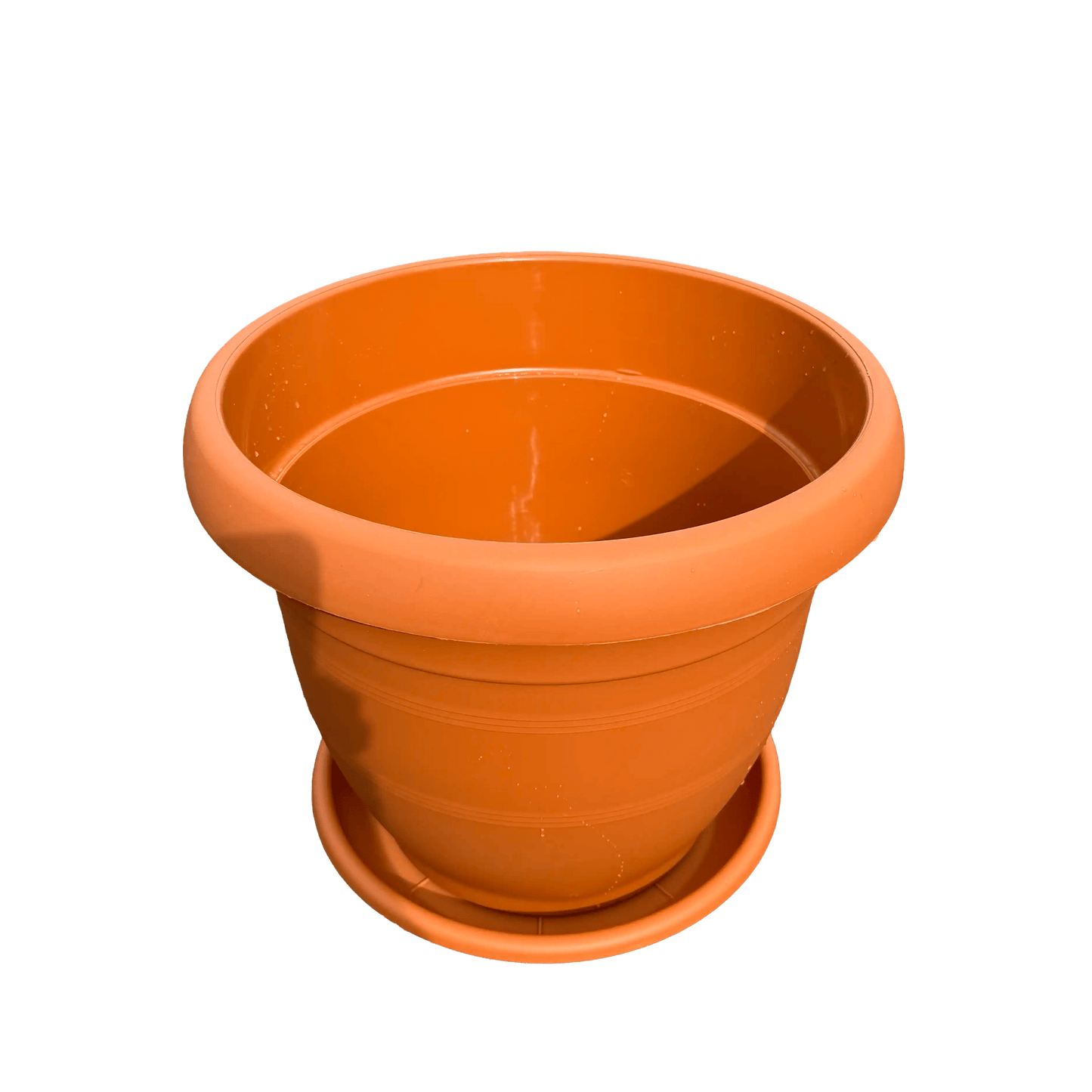 plastic pot with saucer on a white background