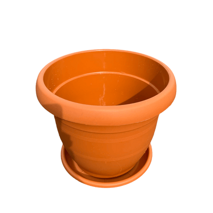 plastic pot with saucer on a white background