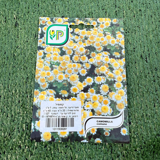 Packaging of Camomilla seeds with a brand logo on a green grass background